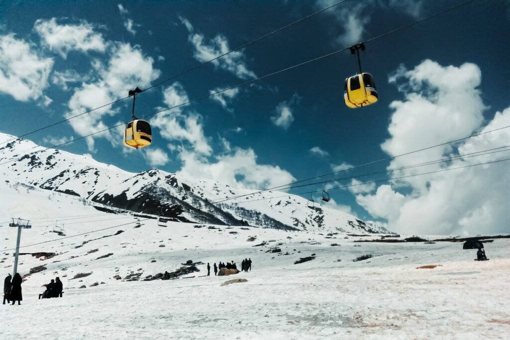 a ski lift going up a snowy mountain in Gulmarg