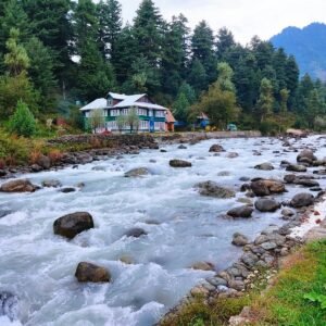a river with a house in the background