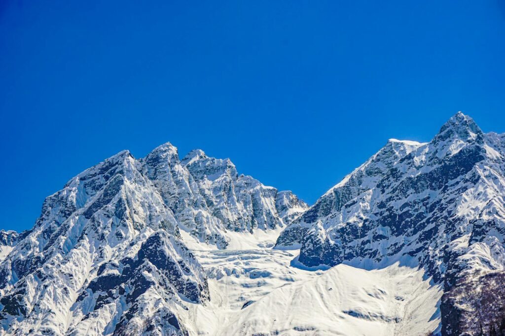Stunning view of the snow-covered mountains in Sonamarg under a clear blue sky.